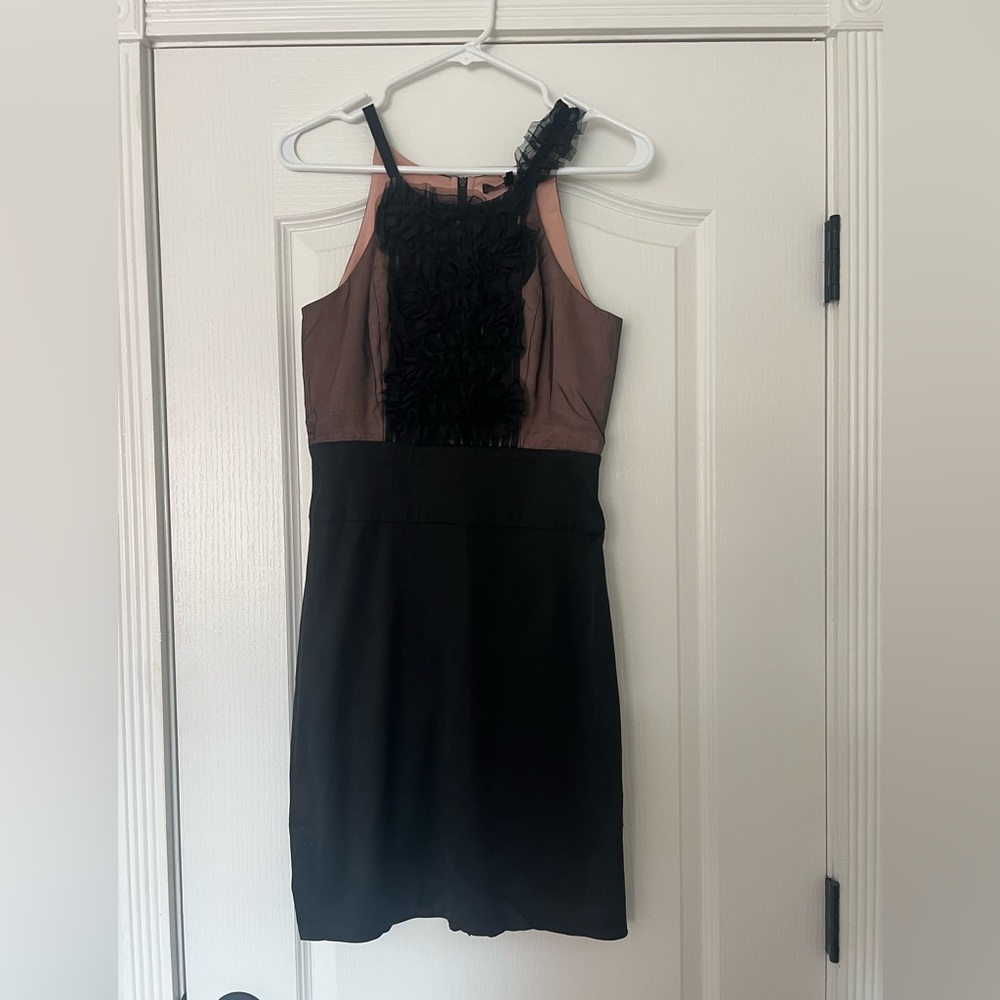 Black BCBG ruffle cocktail dress with back zip closure. Size US 4.